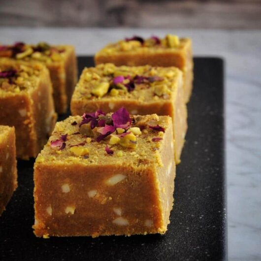Besan barfi is the perfect Diwali sweet. Roasted gram flour, sugar, cardamom, almonds, pistachios, and butter.